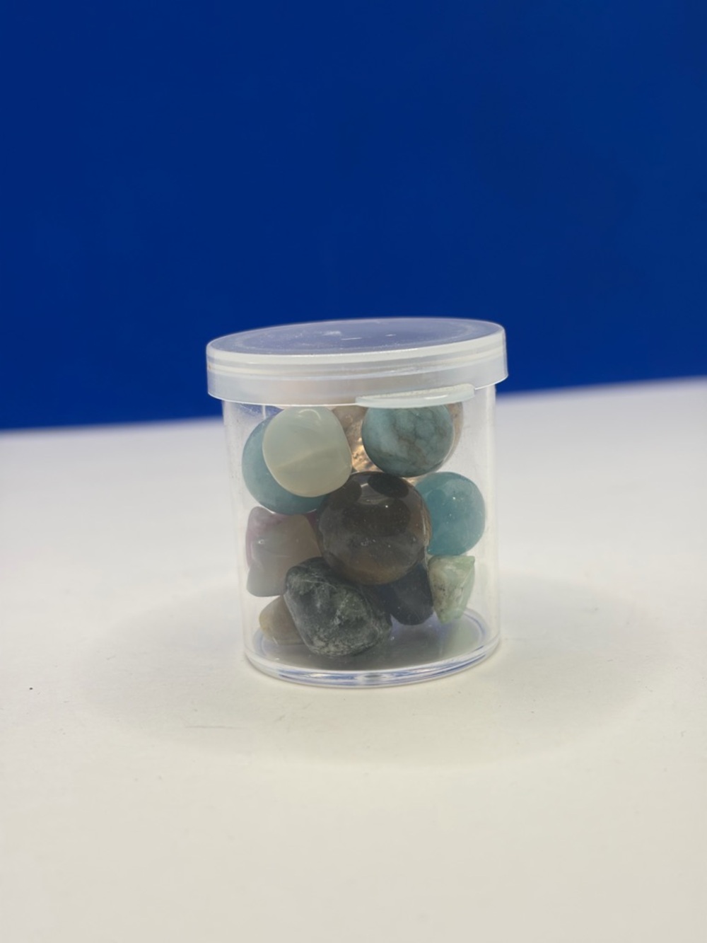 Assorted Polished Crystal Tumbles in 1” Clear Storage Jar - Picture 2 of 5